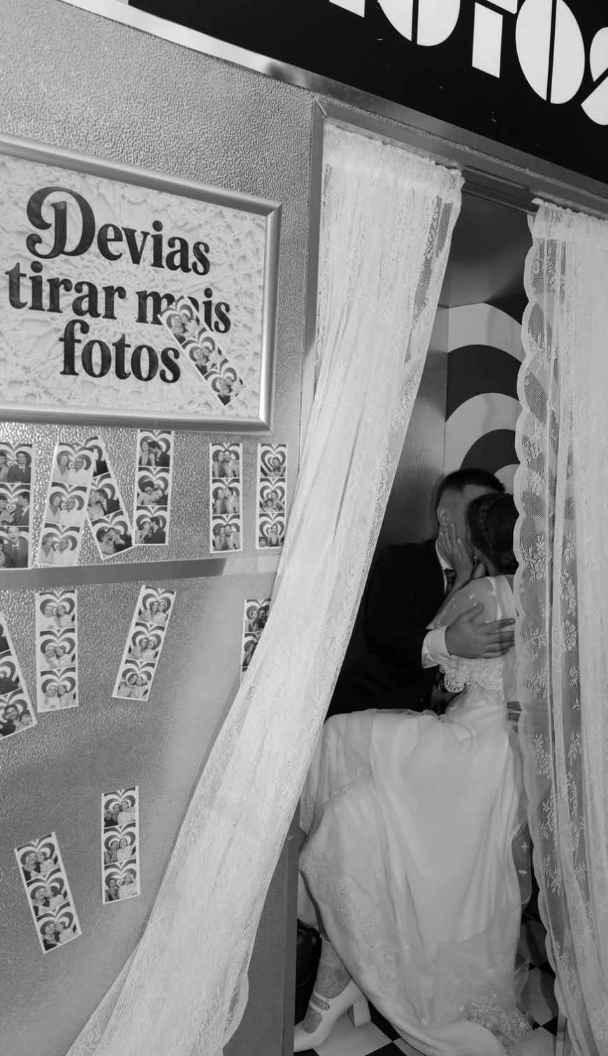 A couple using a Retromat booth at a wedding