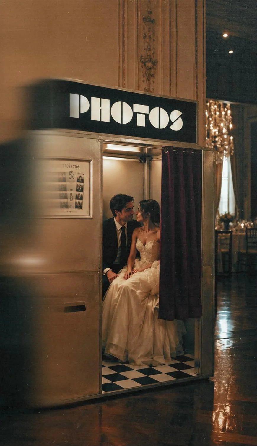 A couple using a Retromat booth at a wedding